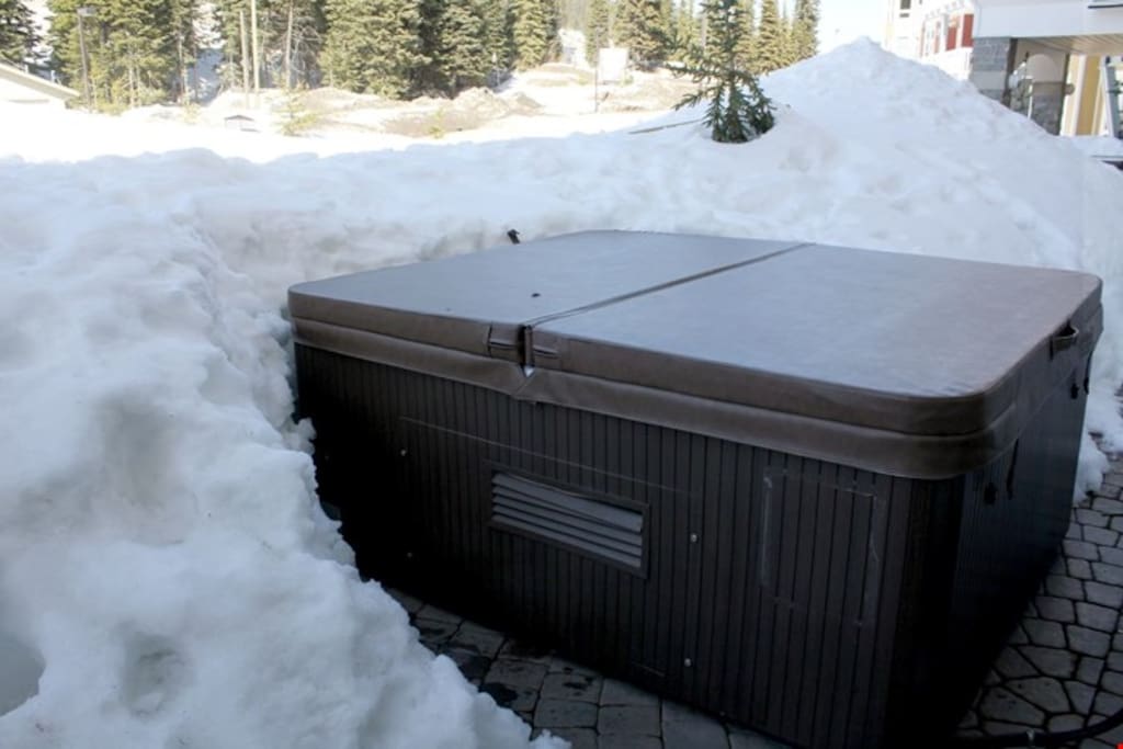Soothe your muscles in the private outdoor hot tub.