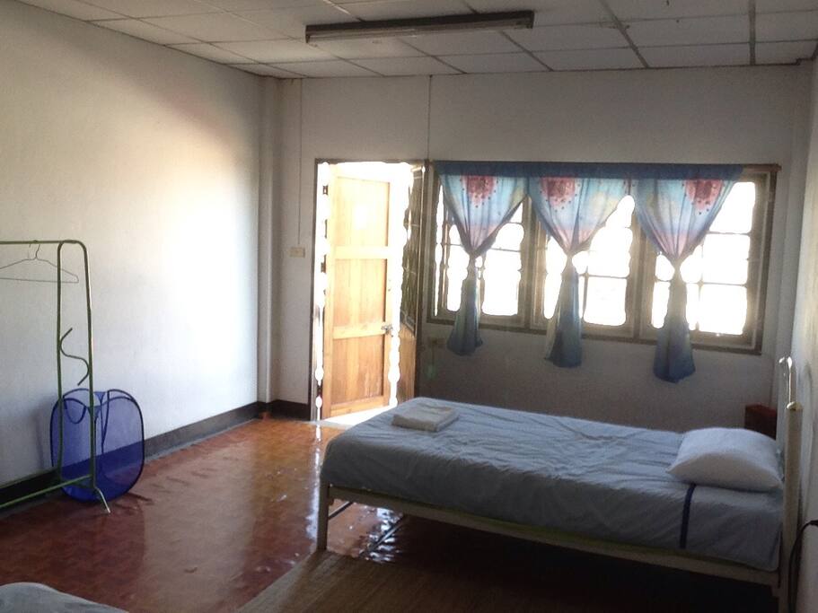 Two single beds and balcony access.