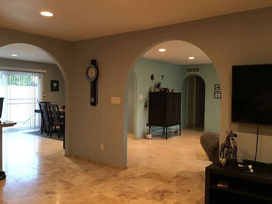 View from living room into kitchen area (left) and entry way (right).