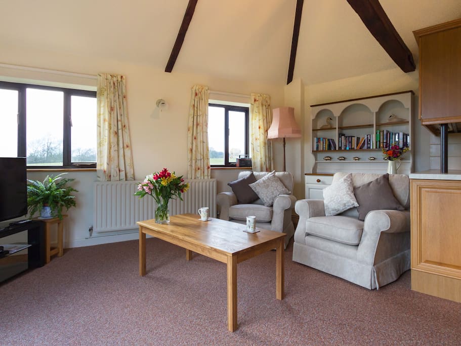 Lounge with vaulted ceiling.