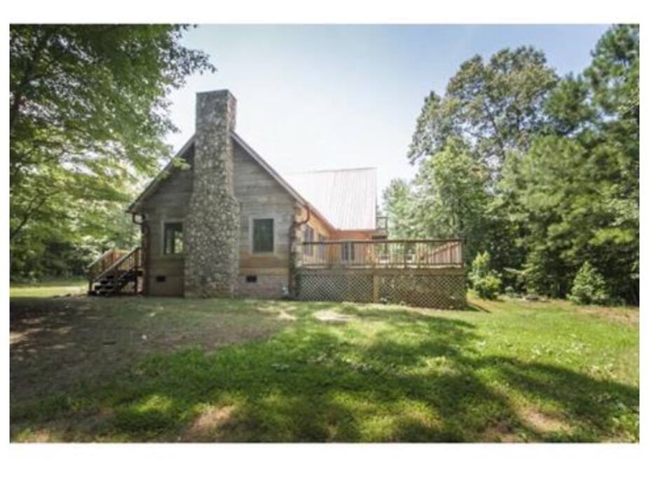 stone fireplace in living room, side view of home