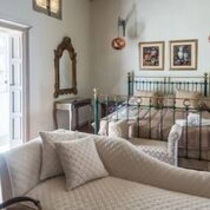 Executive suite with sitting area, original Arabic balcony, en-suite.