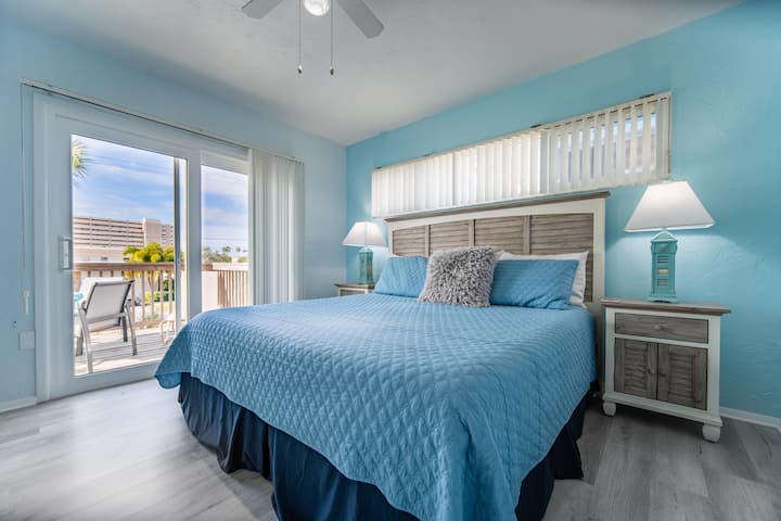Sunset Suite: Newly remodeled 2021. 
King sized bed in the bedroom. 
New flooring, paint, furniture, etc. The bedroom leads out to private wood deck with table, chairs & a sun lounger for your private use.