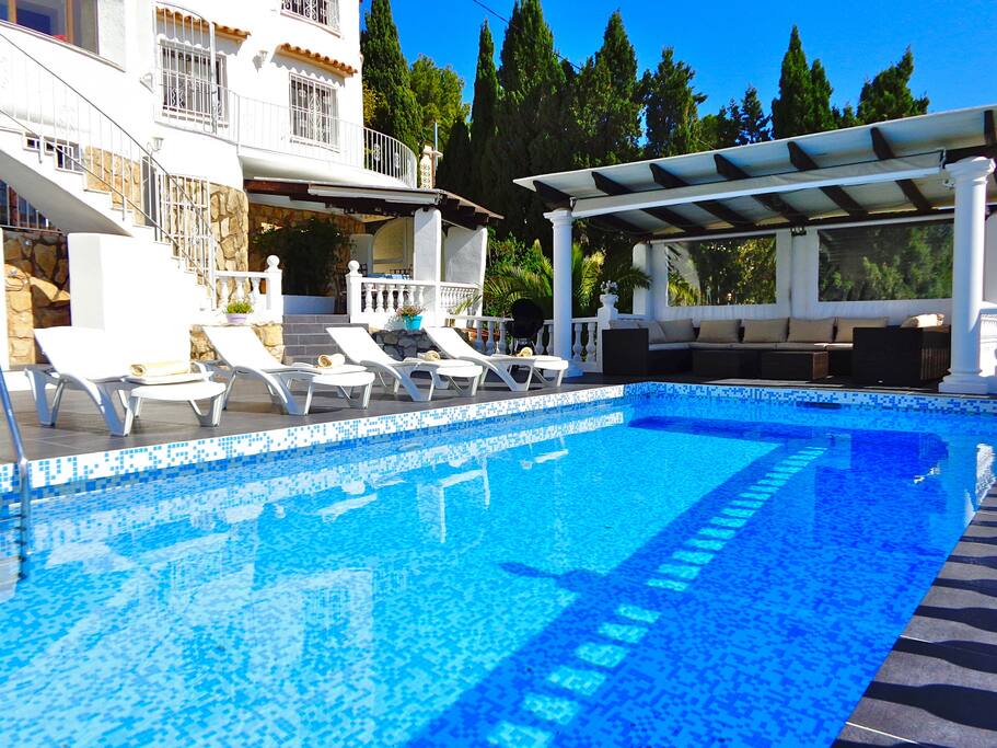 The terrace with the shaded lounging area dining area and the summer kitchen ... the apartment is a level above