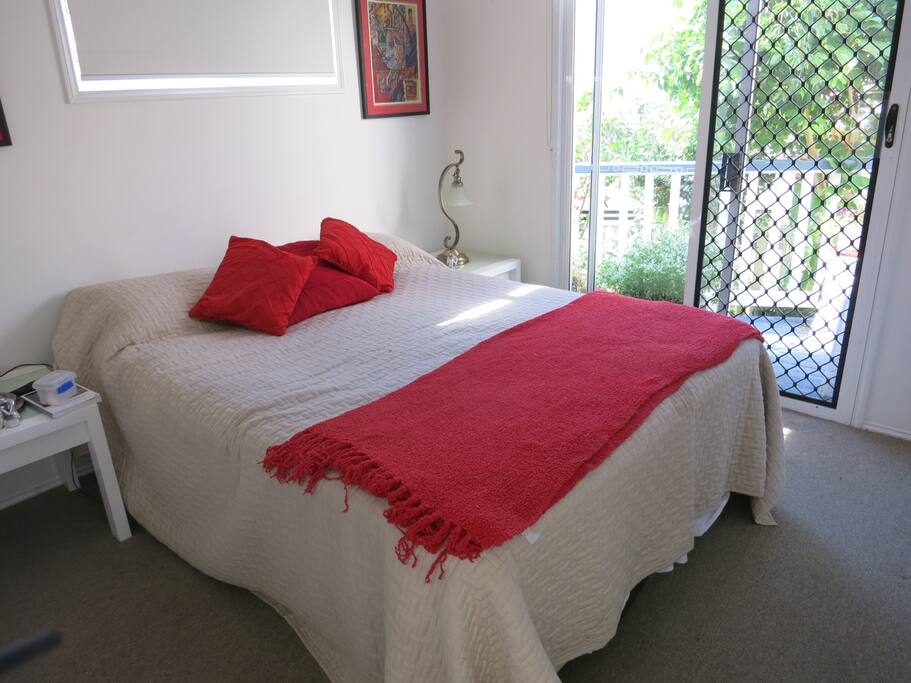 Main bedroom with balcony.