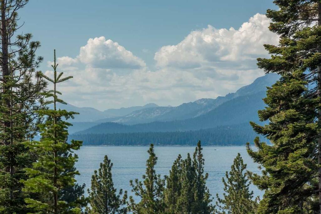 View of lake from main deck and master bedroom balcony.