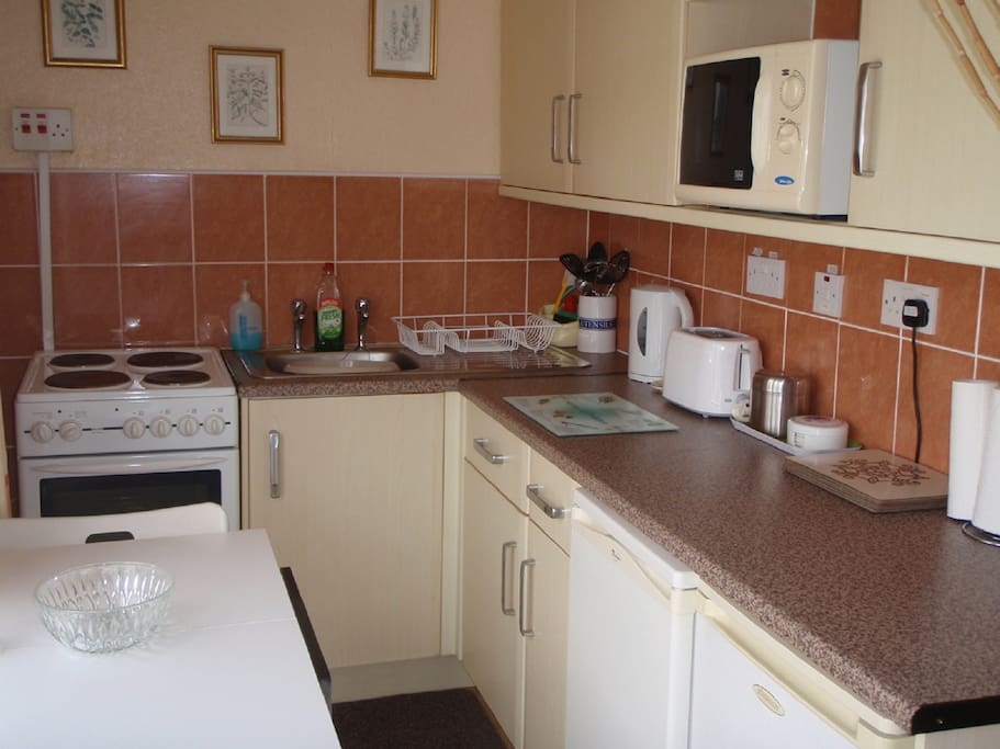The Kitchen with Oven, Hob, Grill, Fridge, Freezer, Microwave, Kettle, Toaster, Pots, Pans, Crockery, Cutlery & Glasses