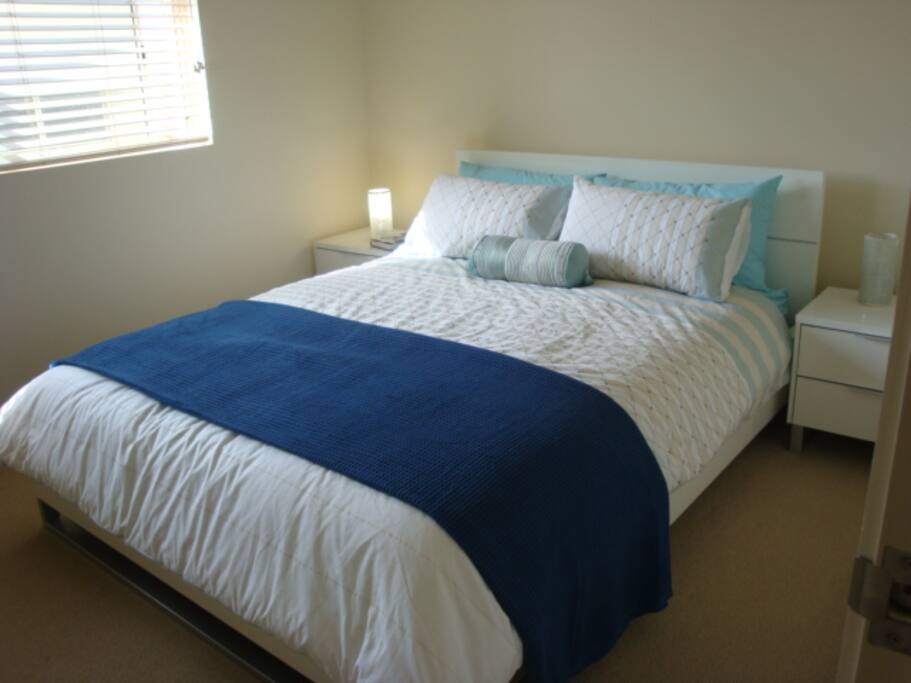 Comfortable queen size bed in main bedroom