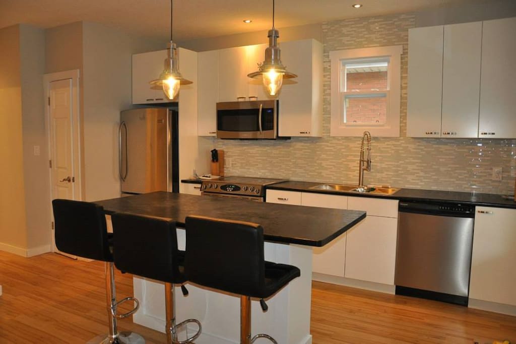 Open concept kitchen/living/dining.