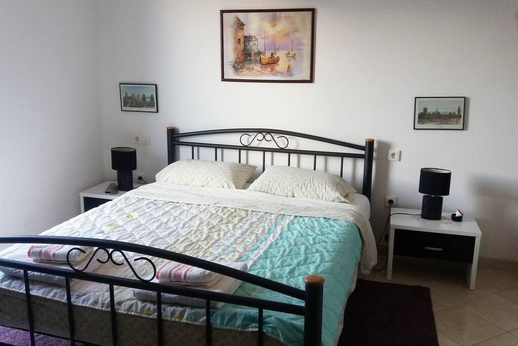 Bed in the studio apartment