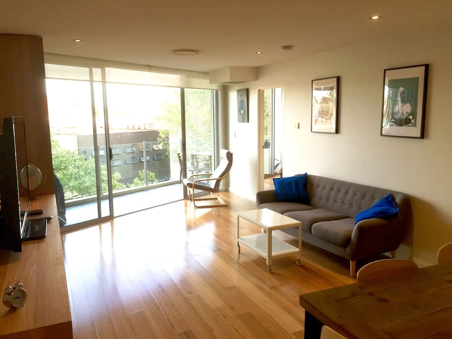 Sunny lounge room opening out to balcony. Solid Australian Blackbutt floors.