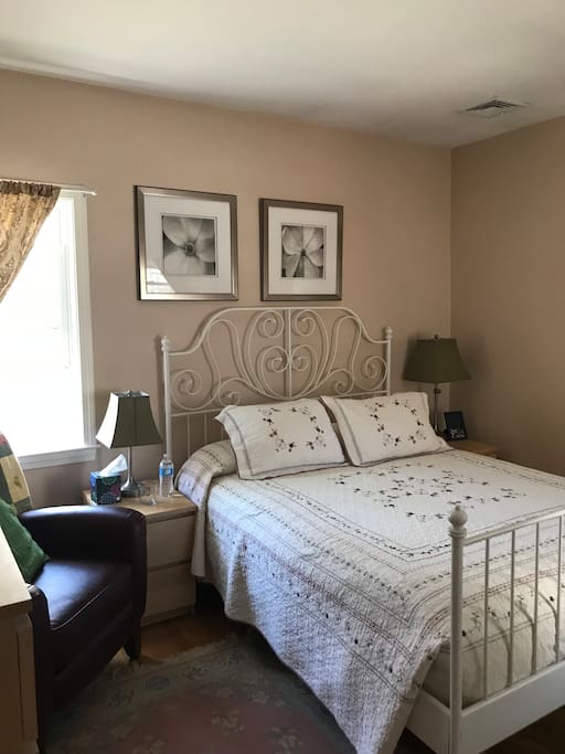 Queen size bed with a memory foam mattress in a typical New England style room. Comfortable and cozy with quilts that are hand made by my 88 yr old me om!