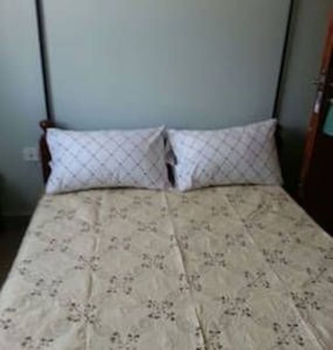 4.5ft by 6ft beds, clean & warm beddings, a small wardrobe, telephone extension, and a reading table