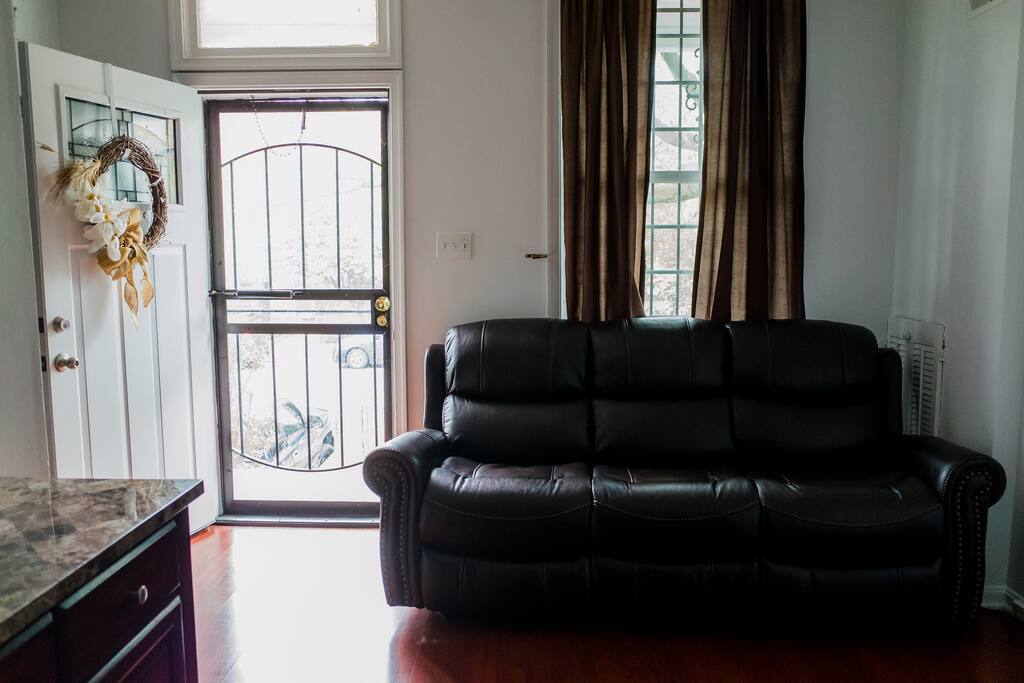 Comfy recline-able sofa right as you get in after a long day of sightseeing.