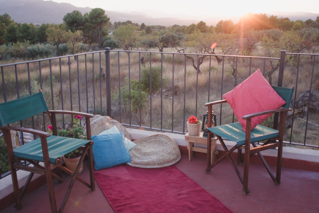 Finca Collita roof-terrace with sunset over the mountains.