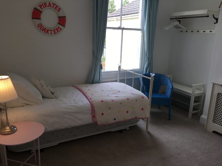 Upstairs twin bedroom with one bed stowed away