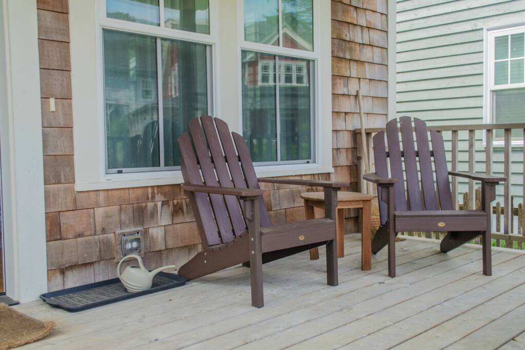 Outdoor seating on the covered front porch to enjoy the outside breeze.