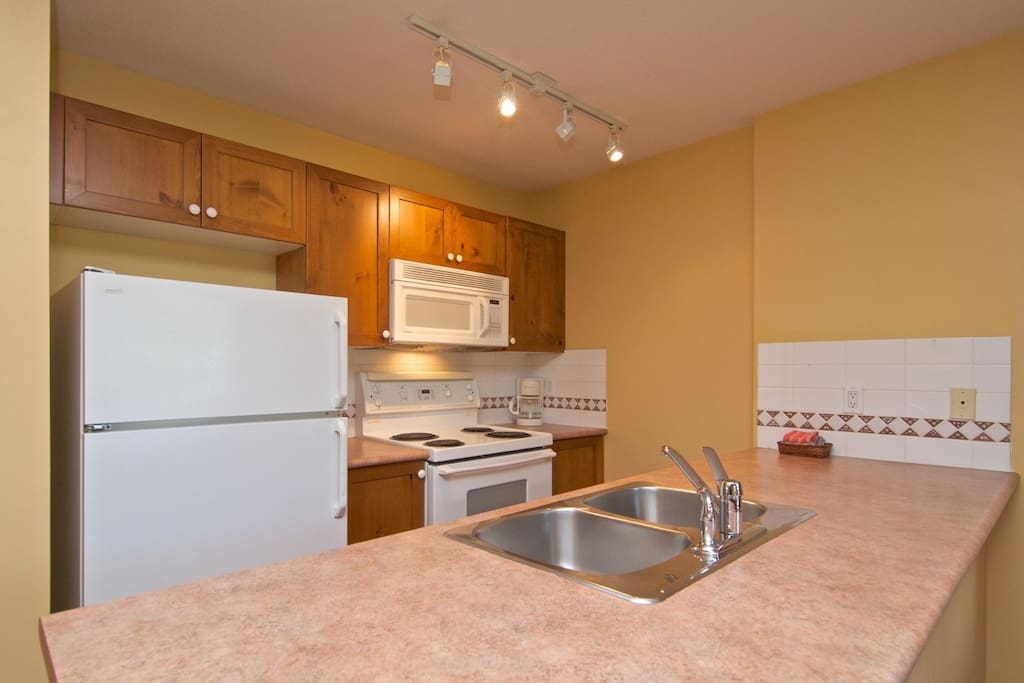 Comfortable kitchen with full sized appliances
