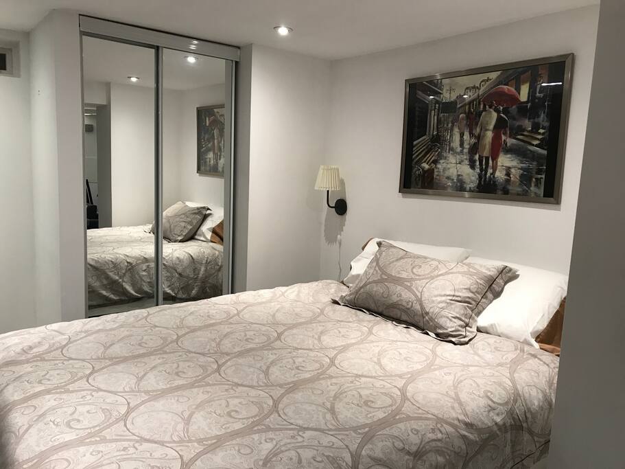 Queen size bed comfortably sleeps two adults