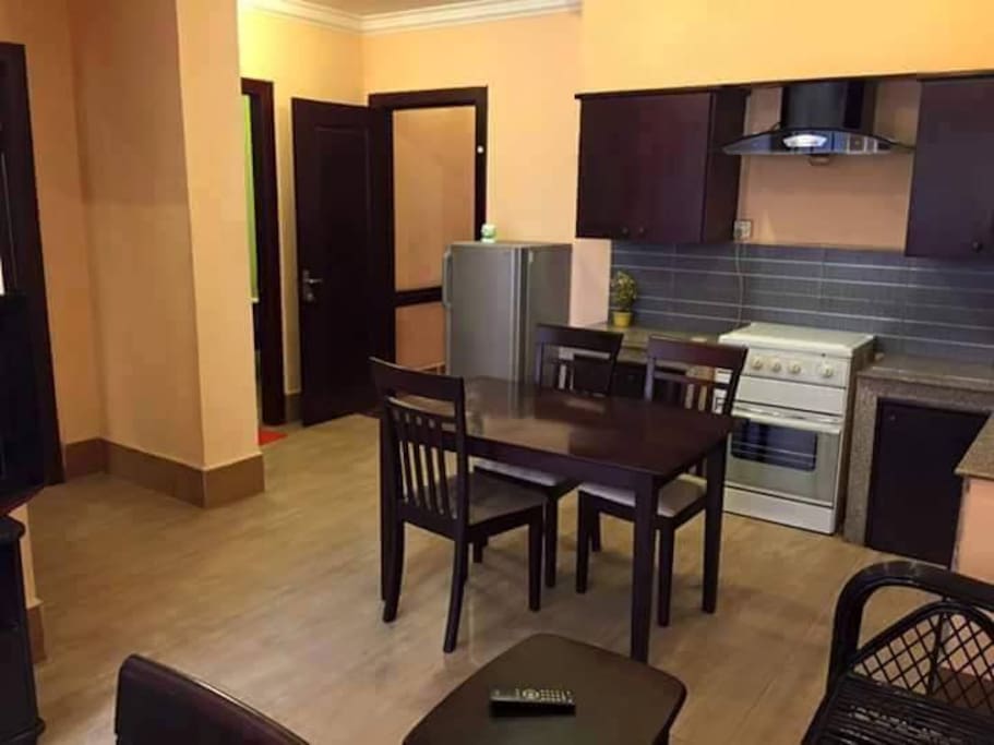 Kitchen area has stove, oven, exhaust, sink, basic storage
