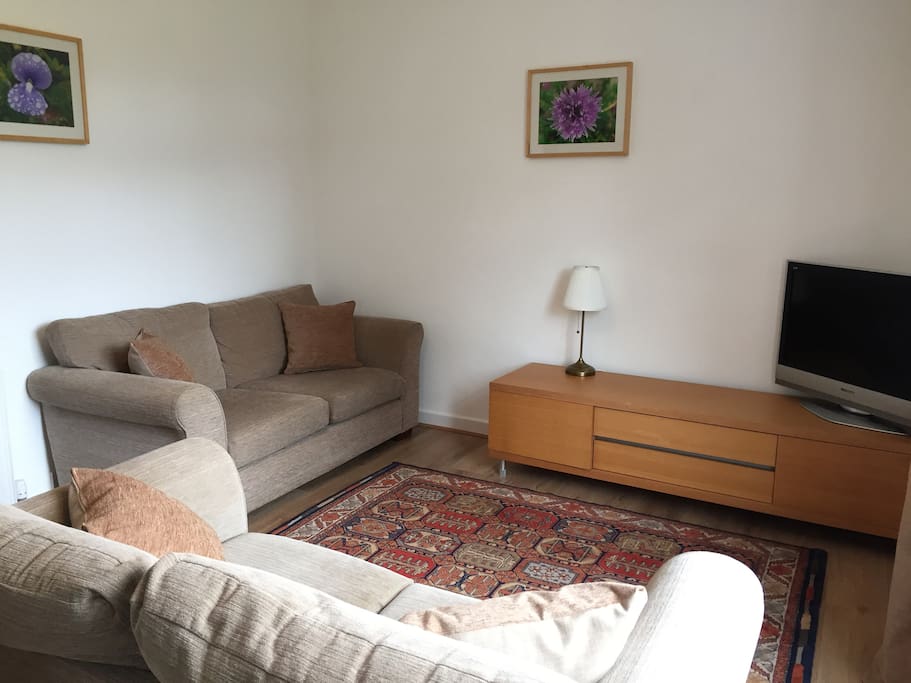 More of same lounge with green views over rear garden and neighbouring school playing fields to Craiglockhart Hill West.
