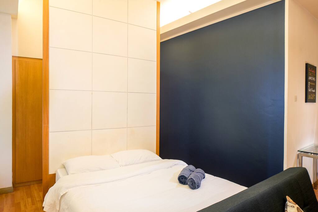 Simple Design Suites Room with Queen size bed with hotel quality linens and towels.
