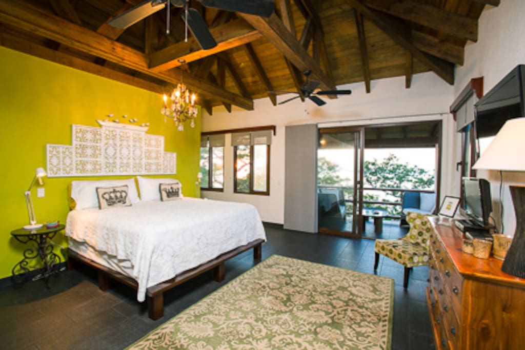 Master bedroom #1 with en suite bath and porch affording a breathtaking sea and reef view.
