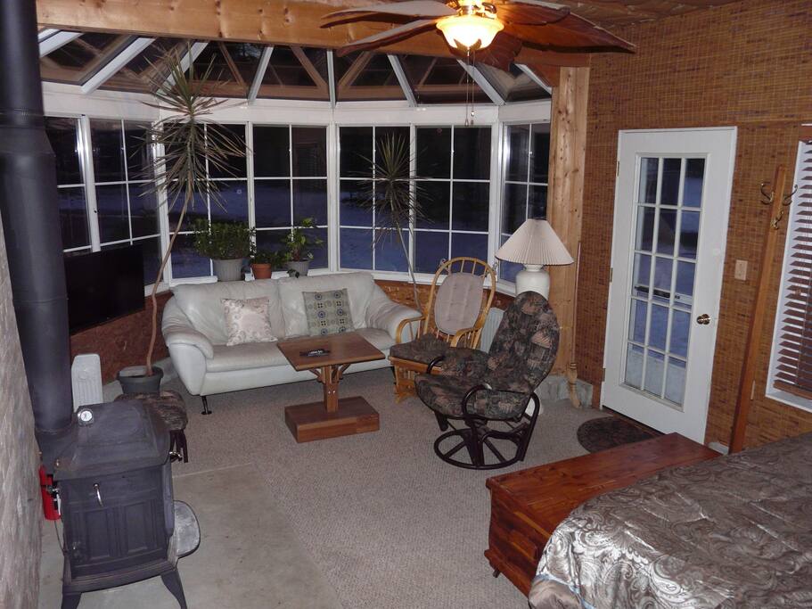 Leather couch, rocking chairs, living plants