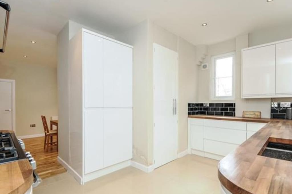 Generous kitchen space with access to all laundry facilities and appliances