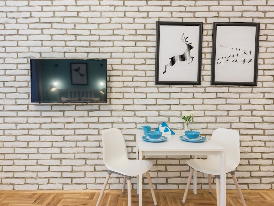 dining area, table, tv set