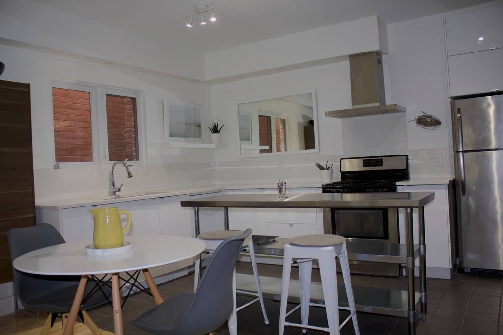 Modern and clean, big kitchen, with industrial island.