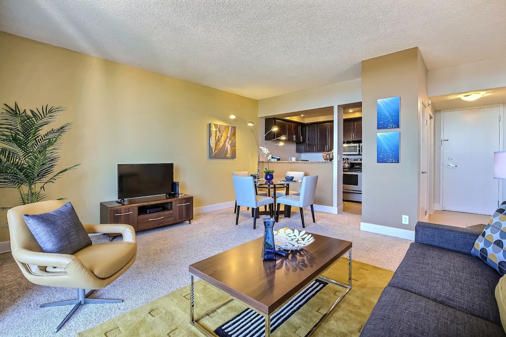 Living room with view into dining area and kitchen