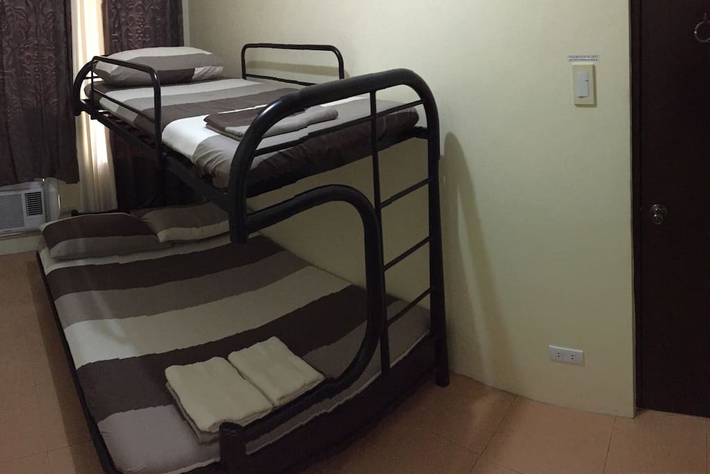 Bedroom 1, full sized bed lower fits 2 adults, single bed upper fits 1 adult
