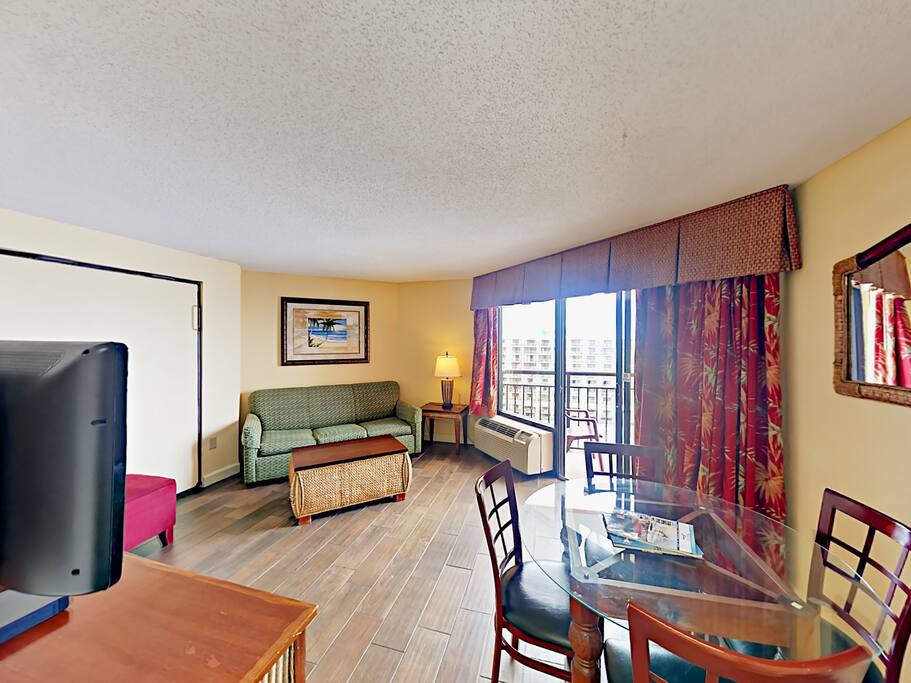 Open-concept living/dining/kitchen area inside the condo.