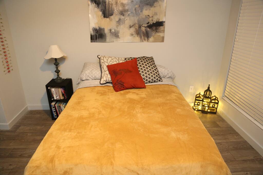 Bed, fairy lights, and books for you to enjoy!