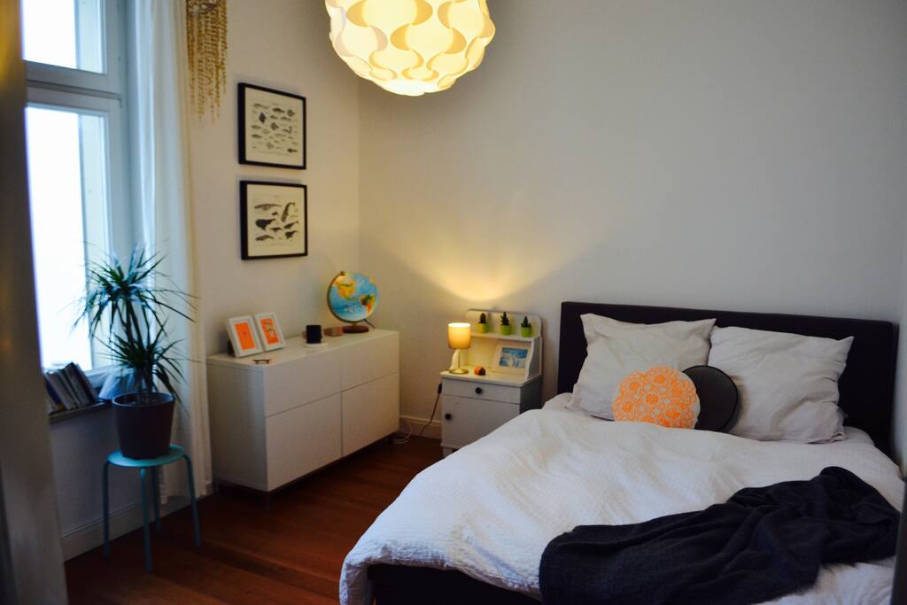 Queensize bed in courtyard facing bedroom.