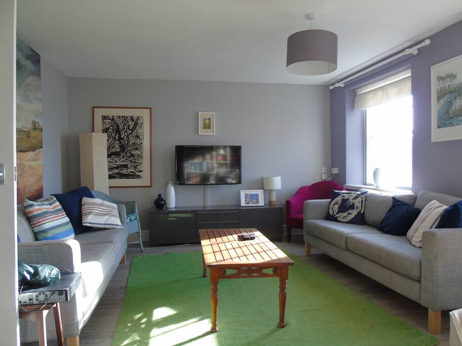Our sitting room has seating for everyone and stunning views over Lyme Bay.
