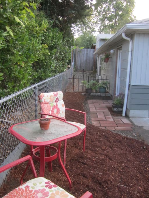 Small sitting area outside entry of room.
