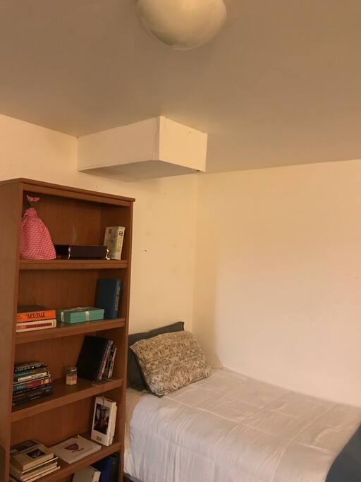 Twin bed in they basement bedroom
