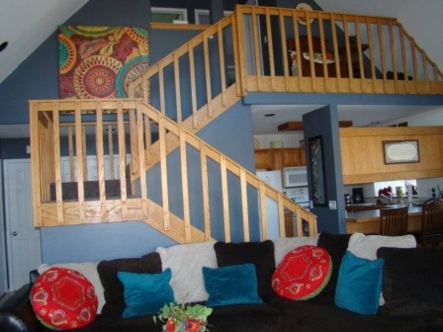 Nicely decorated home with comfortable living room with sectional couch, leather chair, and benches! Gas fireplace to keep it warm and cozy!