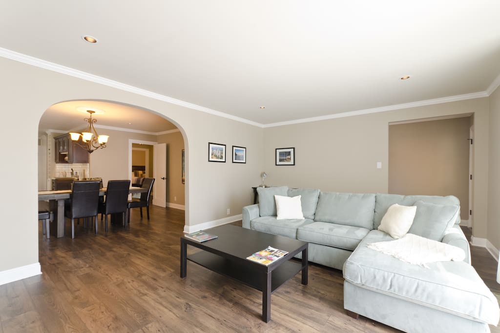 The beautiful open concept living/ dining/ kitchen area is filled with light and provides plenty of space for relaxing.