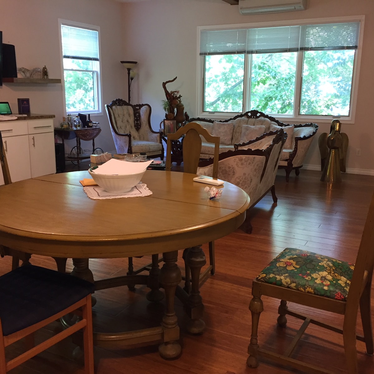 Secluded tree house apartment with high ceilings.