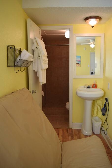 View towards bathroom. 4 sets of towels are provided.