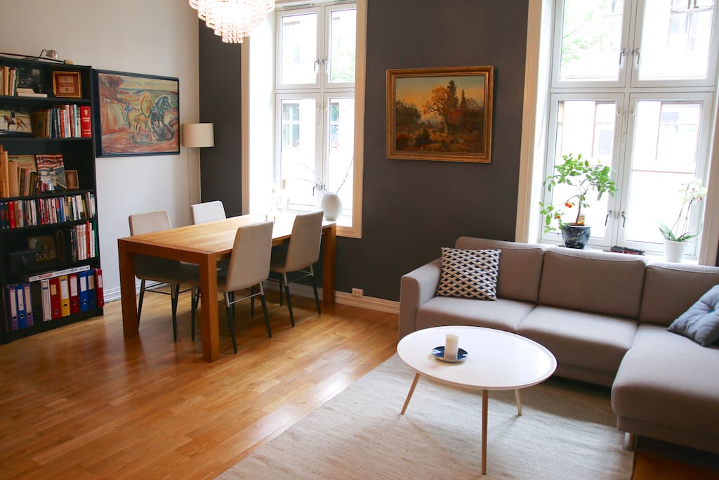 Livingroom with fireplace, chandelier, office desk and other cool details.