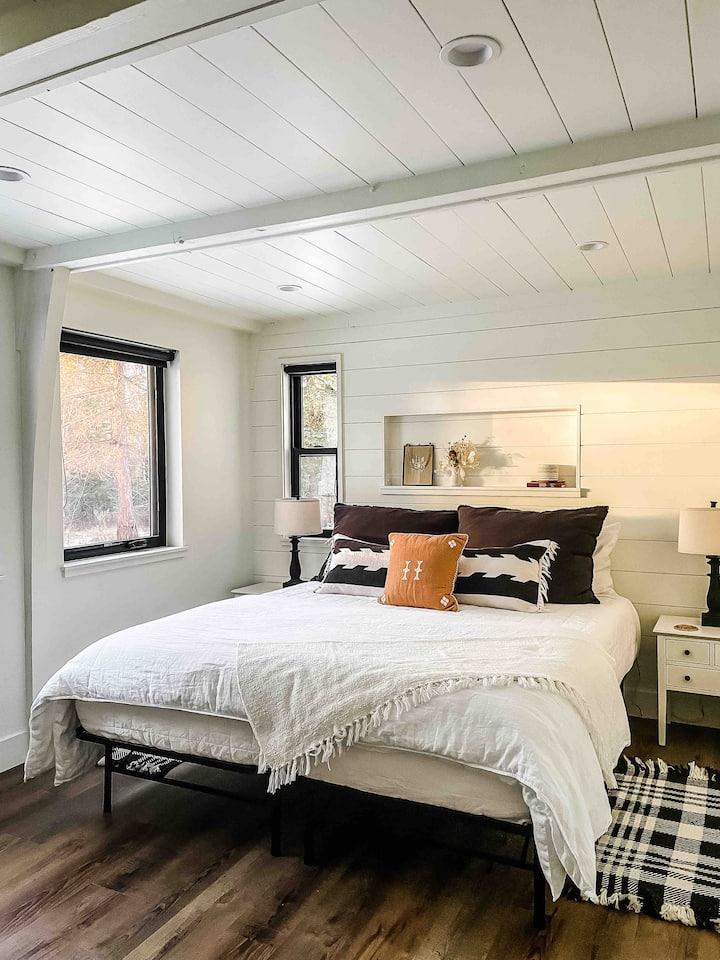 Downstairs guests room with a comfortable king bed located on the main floor across from bedroom 3 and close to bathroom 2. 