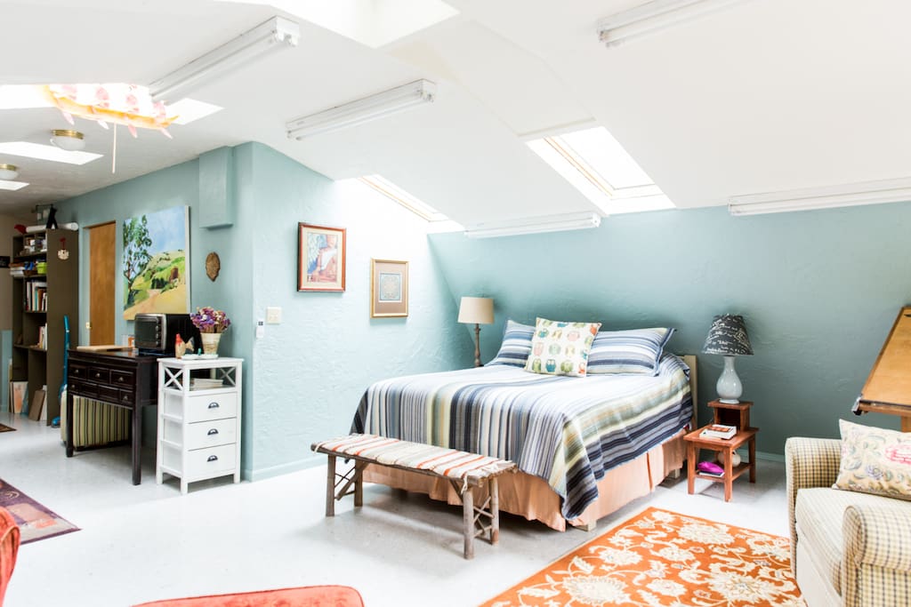 Queen bed under skylights...