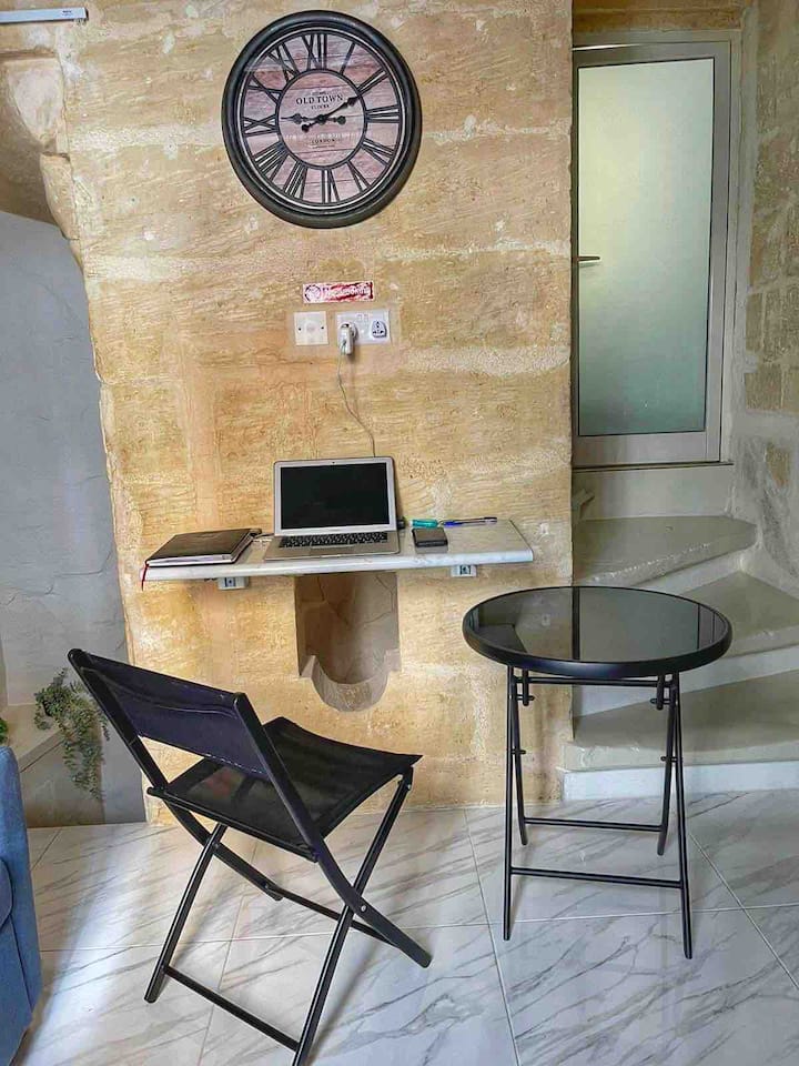 Wall open table which can be used as a working desk/area.
(Laptop not included)