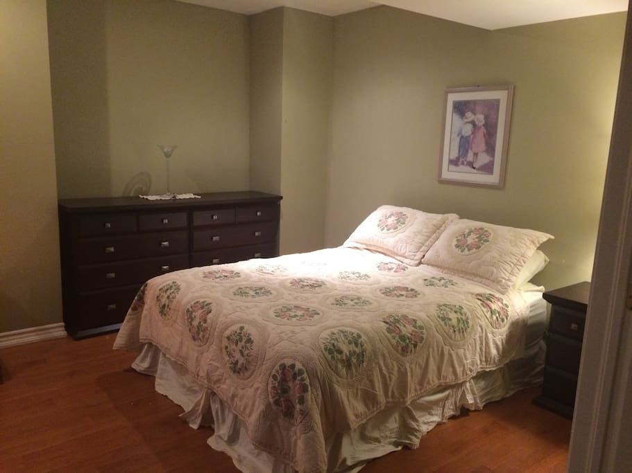 The Green Room. Queen bed, dresser, closet with hangers, full length mirror, Tassimo machine and sitting area.