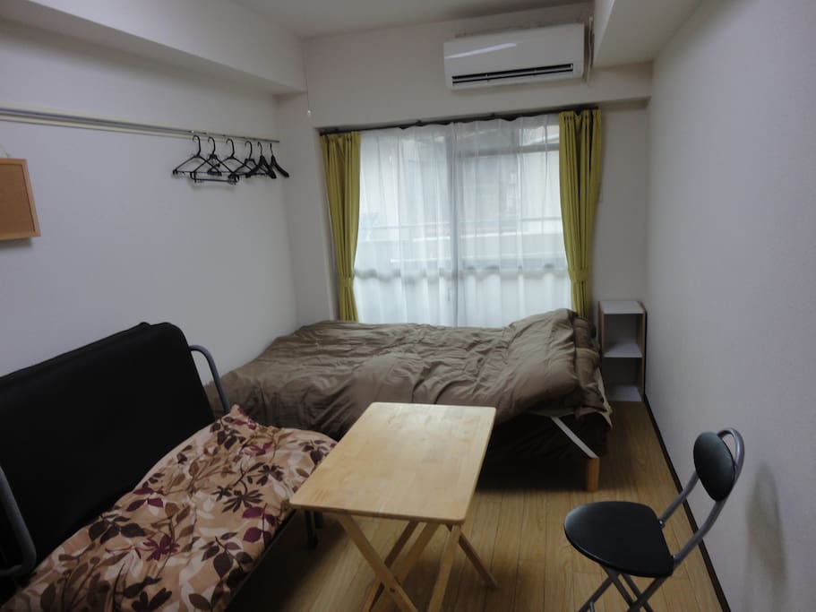 A semi-double bed and a sofa bed