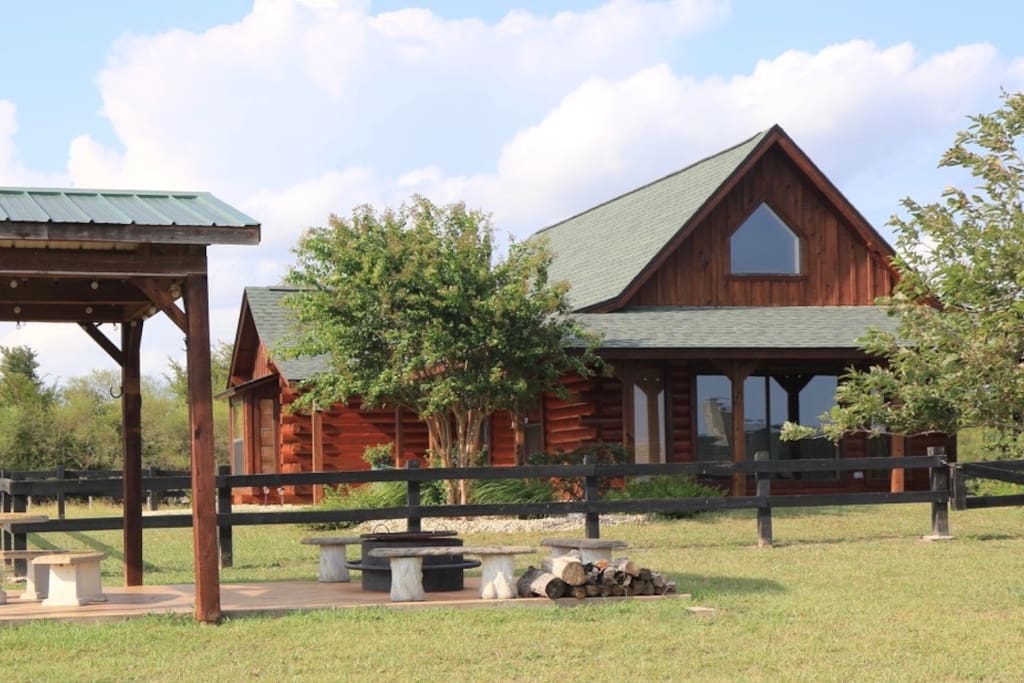 Gorgeous Log Cabin
The Log Cabin is located on a gated 47 acre ranch. You will enjoy panoramic views on 3 porches.
There is a large stocked fishing pond for guests. Bring your own tackle for catch and release fishing. The cabin is furnished with leather sofas, two bedrooms with comfortable bedding and adjoining baths, a sleeping loft with full futons and a fully equipped upscale kitchen.